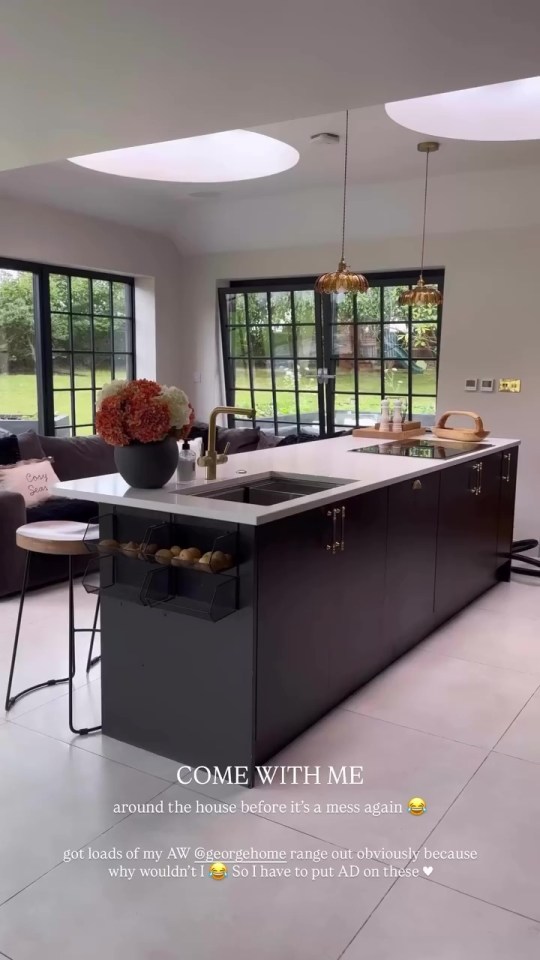 A modern kitchen island with a dark-colored base and white countertop.
