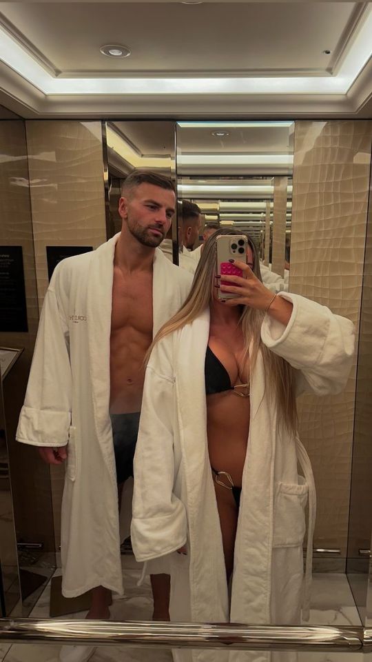 Ella Barnes and her boyfriend in matching white bathrobes.