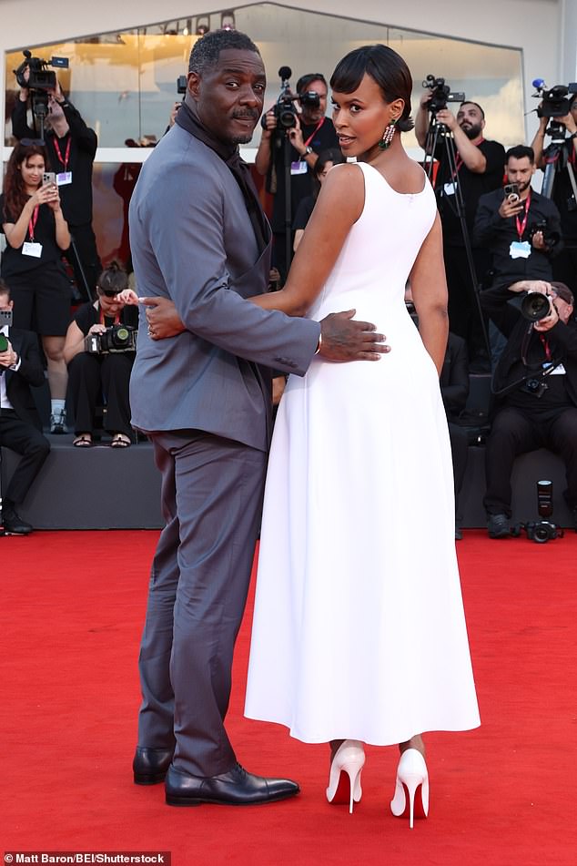 Idris cut a dapper figure in a quirky blue blazer and high neck brown top, teamed with matching trousers and dress shoes