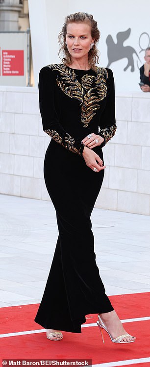 Eva Herzigova showcased her figure in a black and gold gown, teamed with strappy heels