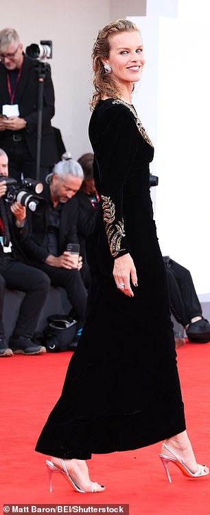 Eva Herzigova showcased her figure in a black and gold gown, teamed with strappy heels