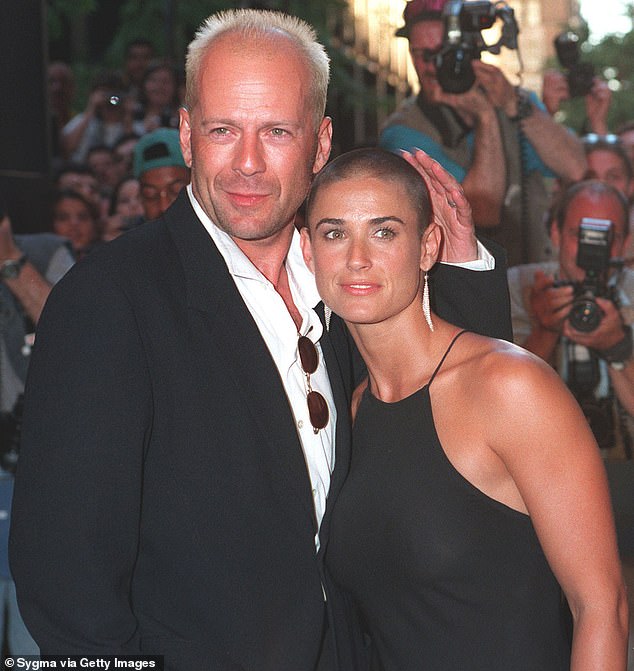 Bruce and Demi are pictured during their marriage arriving at the premiere of her 1996 film Striptease, with Demi having already shaved her head for her lead role in G.I. Jane