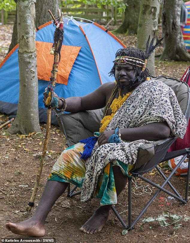 Kofi Offeh, 36, from Ghana, calls himself 'King Atehene'. He is seen sitting on a camp chair in his new 'kingdom'