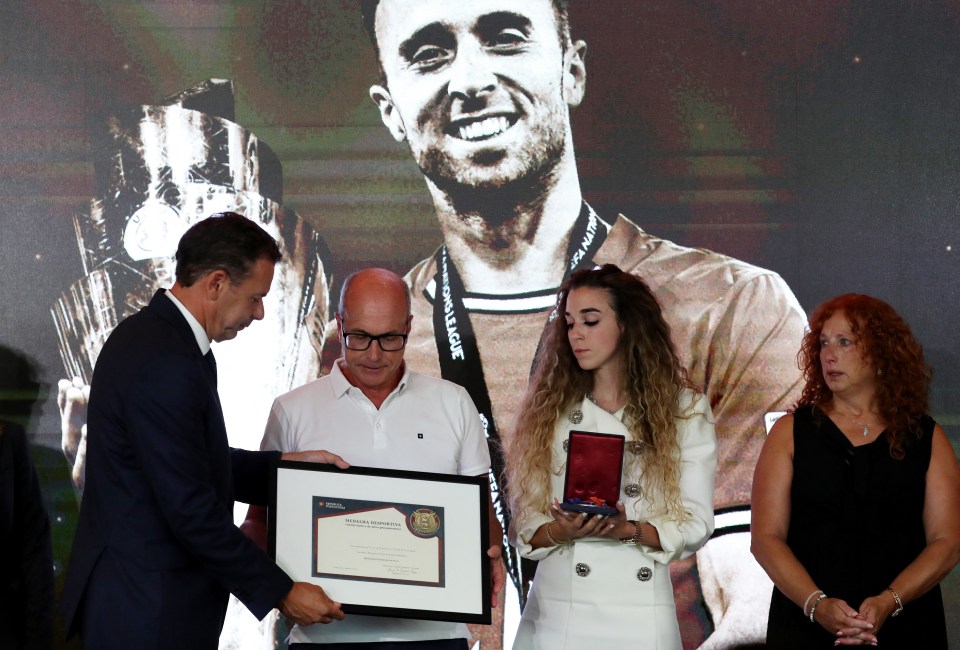 Portuguese Prime Minister Luis Montenegro presenting an award.
