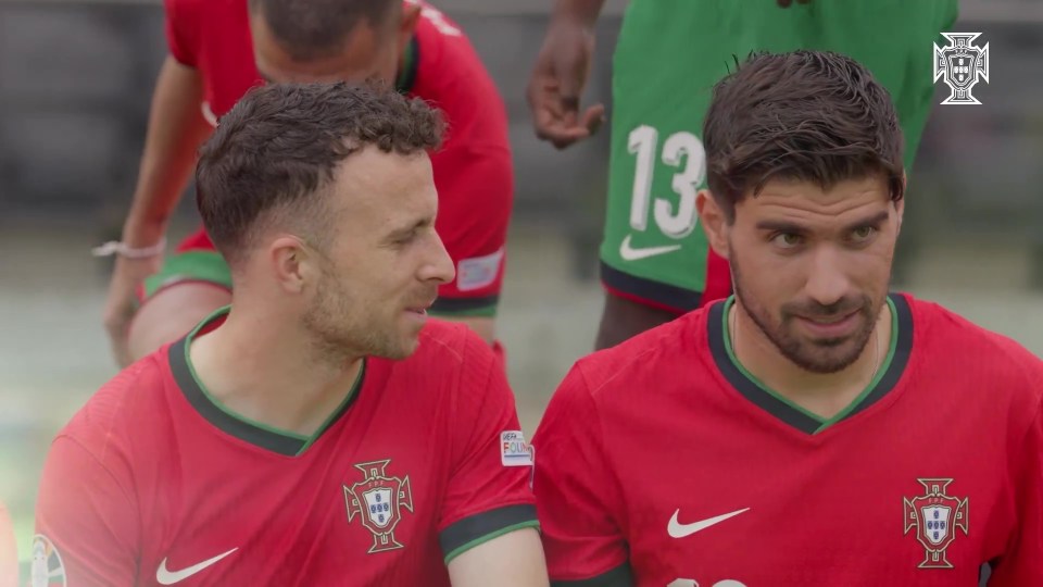 Ruben Neves and another Portuguese soccer player in team jerseys.