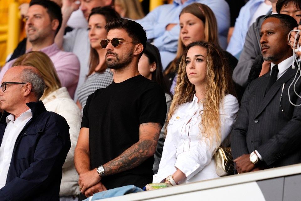Diogo Jota's wife and Ruben Neves in the stands at a soccer match.