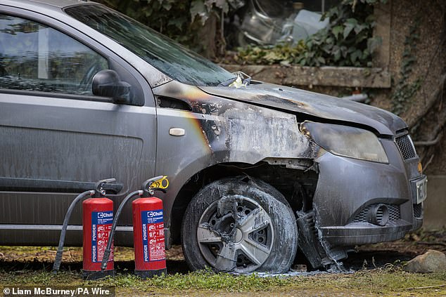 Pictured: A destroyed car in Ballymena, Co Antrim