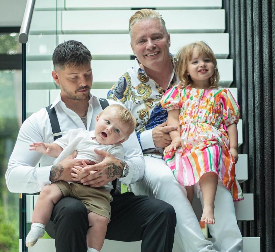 Barrie Drewitt-Barlow with his partners and children.