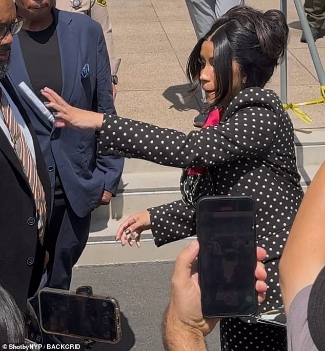 The Bodak Yellow hitmaker - who is now dating NFL player Stefon Diggs - reacted by furiously throwing the pen in her hand at the man who posed the question