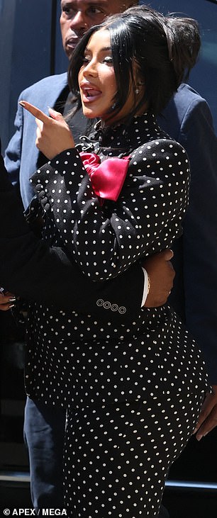 'That¿s for disrespecting me - don¿t disrespect me,' Cardi fumed as her bodyguard steered her away towards her waiting car