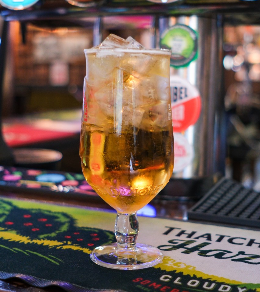 Beer with ice in a stemmed glass.
