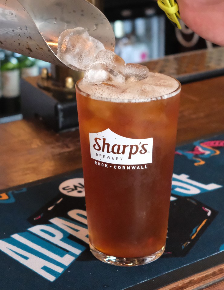 Ice being added to a glass of Sharp's Brewery beer.