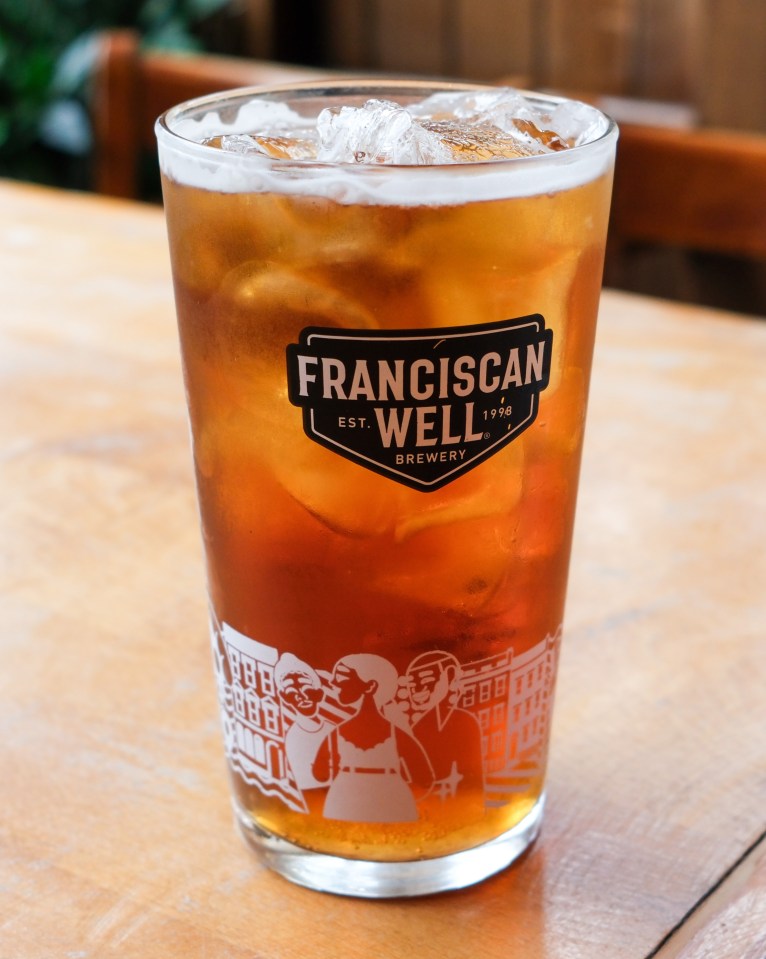 Iced beer in a Franciscan Well Brewery glass.