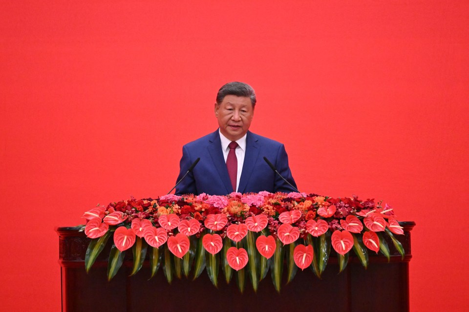 President Xi Jinping speaking at a podium.