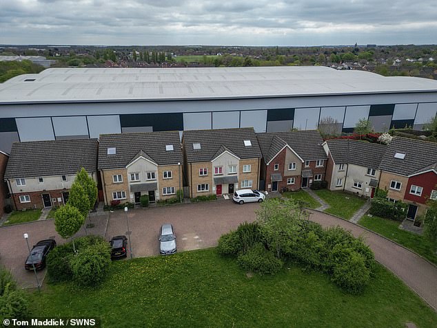 Homeowners in Corby have had enough and say their lives have been ruined by the huge warehouses which tower over their homes
