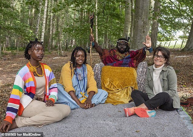 Jane Fryer (right) with King Atehene, his queen Nandi and handmaiden Asnat (far left) in their camp in woods in Jedburgh, Roxburghshire, sandwiched between an industrial estate and a car park
