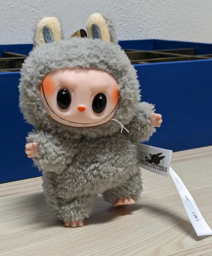 Lafufu plush toy in a gray bunny costume.