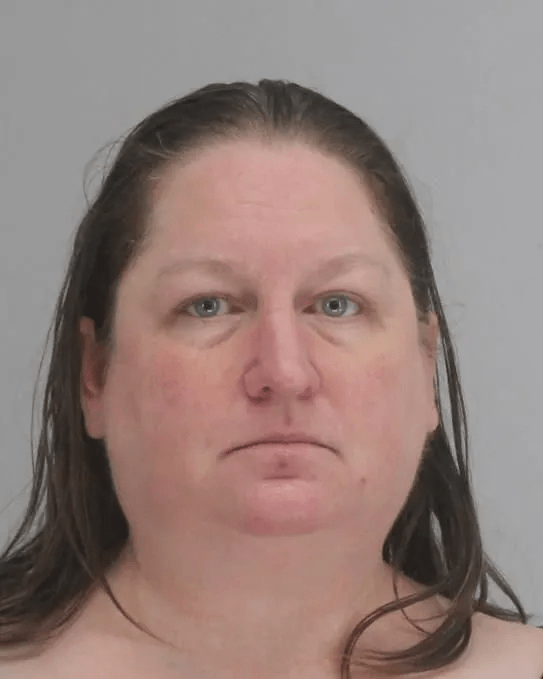 Mugshot of a woman with brown hair.
