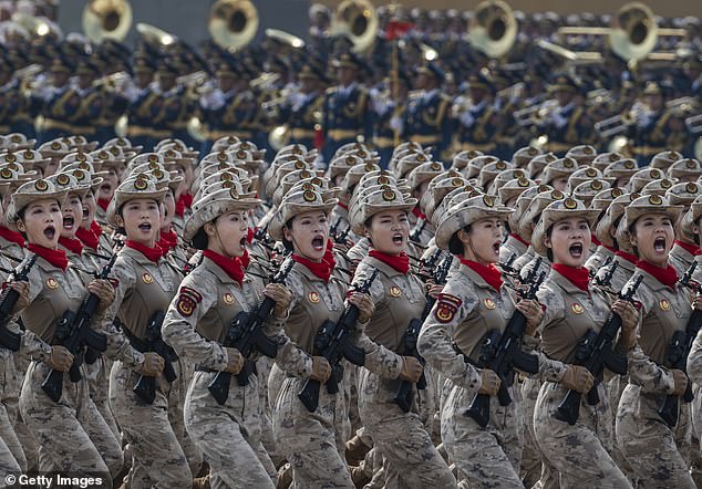 Chinese female soldiers shout as they march during a military parade marking the 80th anniversary of victory over Japan and the end of World War II, in Tiananmen Square on September 3, 2025