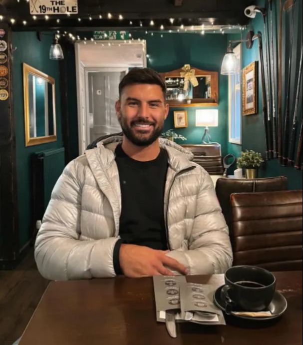 Liam Reardon sitting at a table in a restaurant.