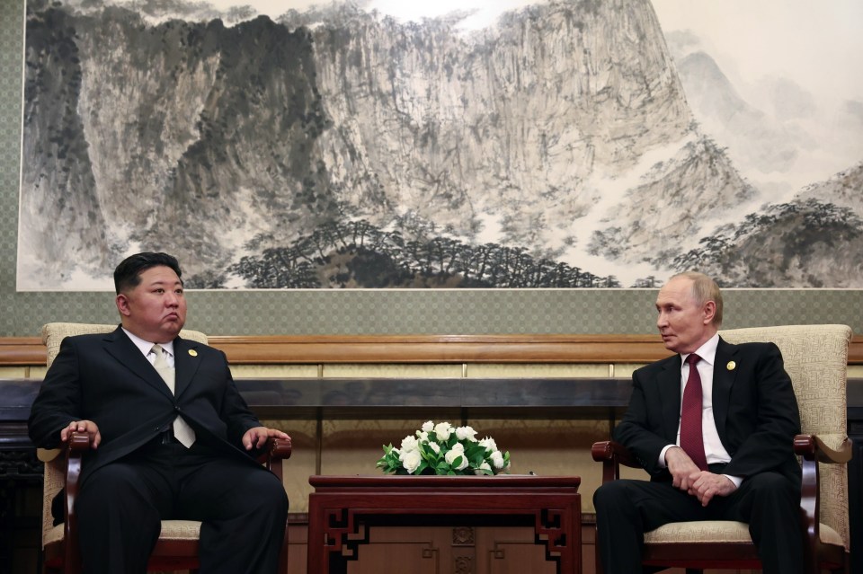 Vladimir Putin and Kim Jong Un meeting in Beijing.