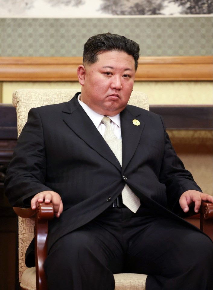 Kim Jong Un seated during a meeting.