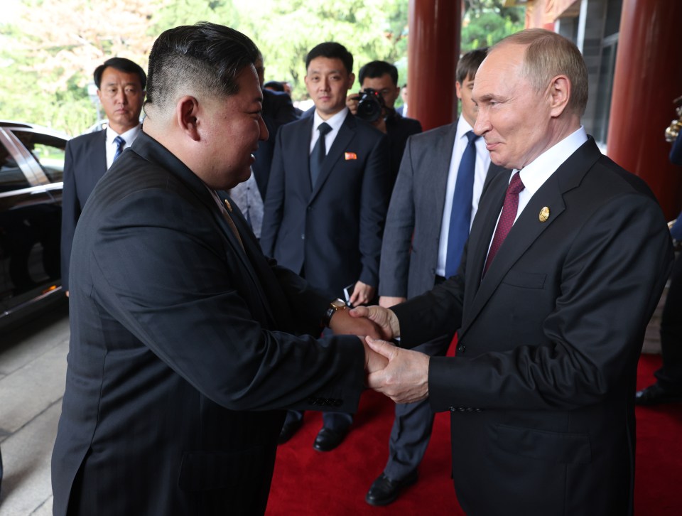 President Putin and Kim Jong Un shaking hands in Beijing.