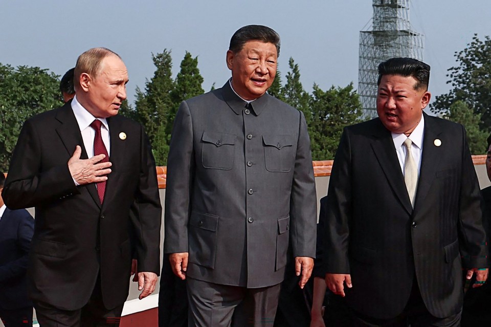 Putin, Xi Jinping, and Kim Jong Un walking together.