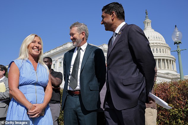 U.S. Rep. Marjorie Taylor Greene, R-Ga., speaks with Rep. Thomas Massie, R-Ky., and Rep. Ro Khanna, D-Calif., during a news conference with alleged victims of disgraced financier and sex trafficker Jeffrey Epstein outside the U.S. Capitol