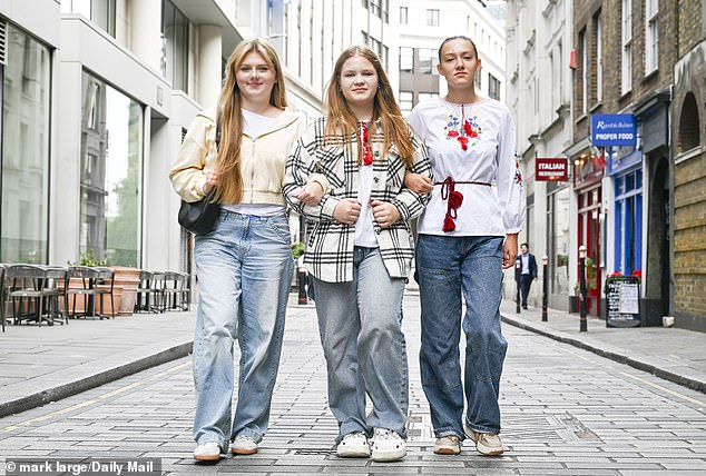 Dasha Kuzhietsova, 14, Maria Tieterina, 14, Victoria Syzonova, 14, outside St Paul's Cathedral in London