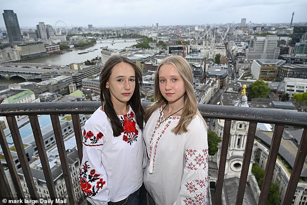 Sofia Babenko, 13, with Yana Shevets, 14, after climbing to the top of St. Paul's Cathedral, London