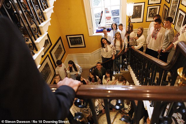 Prime Minister Keir Starmer saying hello to Ukrainian school students in 10 Downing Street