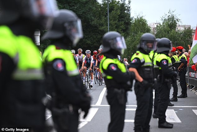 Four police officers were reportedly injured, with three arrests made in total