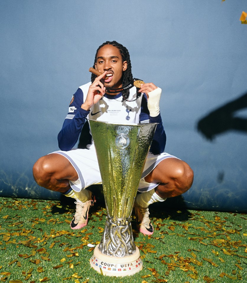 Djed Spence of Tottenham Hotspur with the UEFA Europa League trophy and medal.