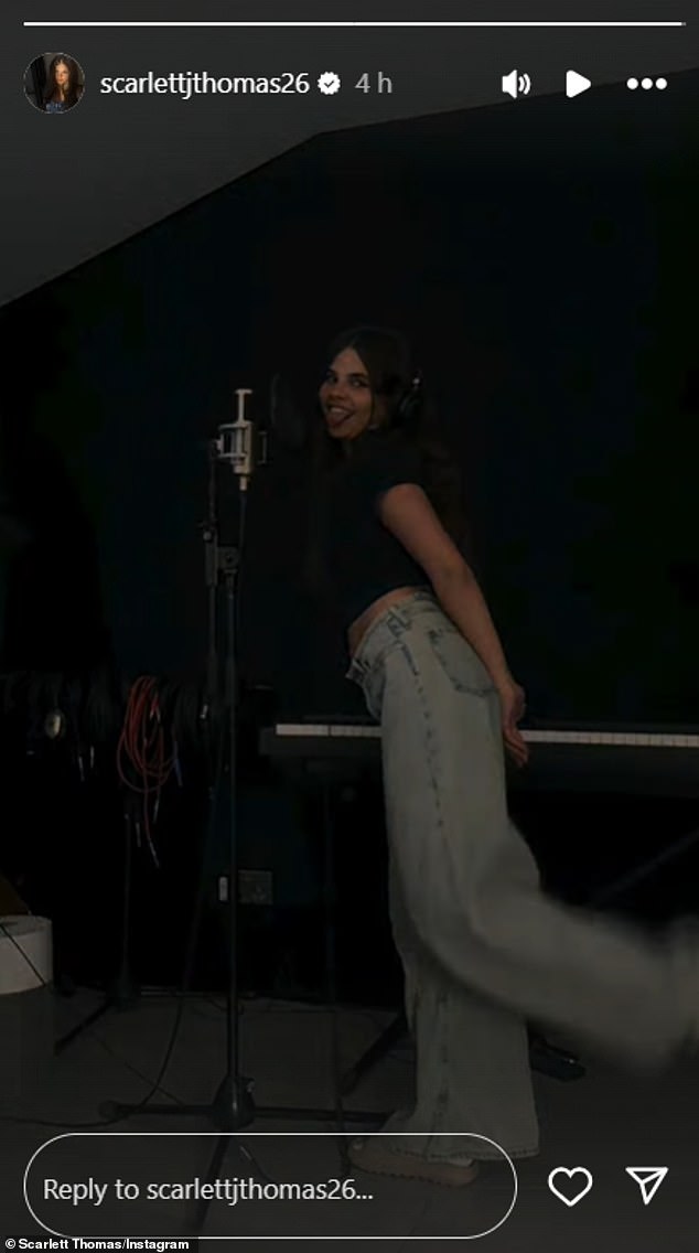 In the final clip, Scarlett was seen in a studio standing in front of a microphone recording a new project