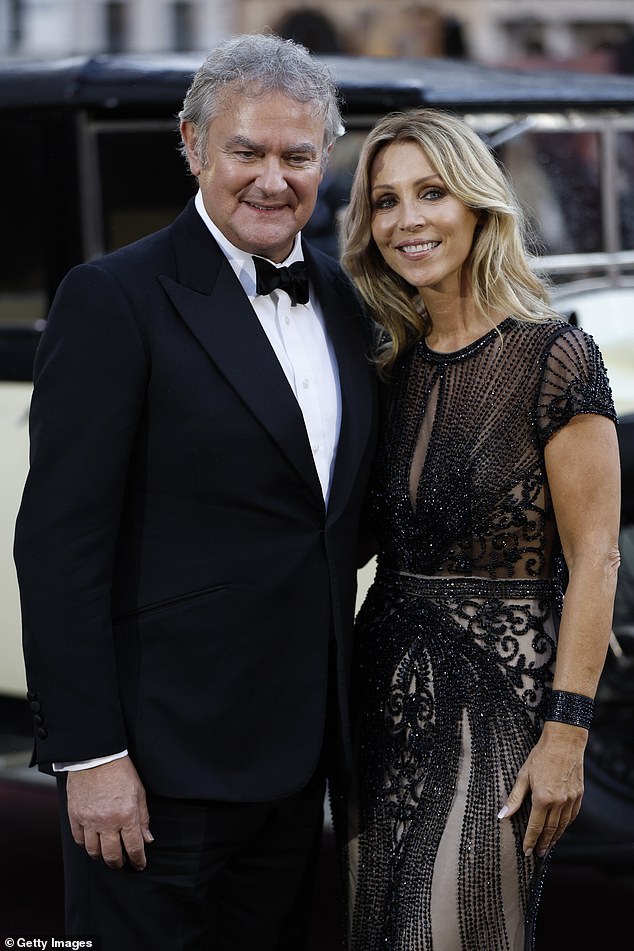 Meanwhile Heidi coordinated with the Paddington star in a glamorous black and nude dazzling gown which showed off her amazing figure
