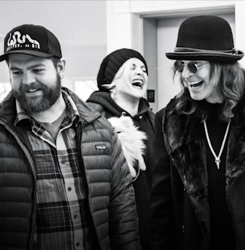 Black and white photo of Jack Osbourne with family and friends.