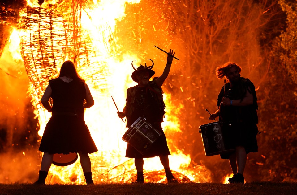 Pentacle Drummers perform at a bonfire.