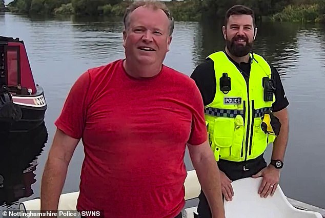 Pictured: The boat owner with an officer