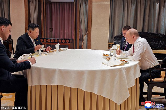 North Korean leader Kim Jong Un and Russian President Vladimir Putin meet for a work breakfast during their visit to Beijing