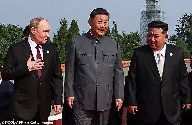 (L-R) Russia's President Vladimir Putin walks with China's President Xi Jinping and North Korea's leader Kim Jong Un before a military parade marking the 80th anniversary of victory over Japan and the end of World War II, in Beijing's Tiananmen Square on September 3, 2025