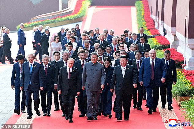 North Korean leader Kim Jong Un and Russian President Vladimir Putin walk with Chinese President Xi Jinping