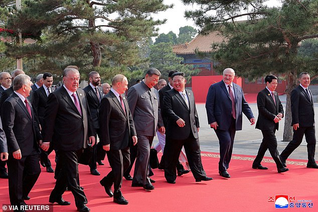 North Korean leader Kim Jong Un and Russian President Vladimir Putin walk with Chinese President Xi Jinping