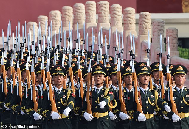 Parade guards step in place before a grand gathering to mark the 80th anniversary of the victory in the Chinese People's War of Resistance against Japanese Aggression and the World Anti-Fascist War in Beijing