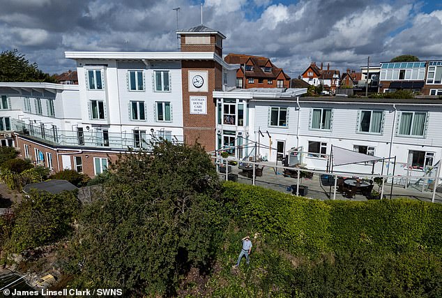 Mr Young said he was 'incandescent with rage' to find them chopping back the trees and the undergrowth