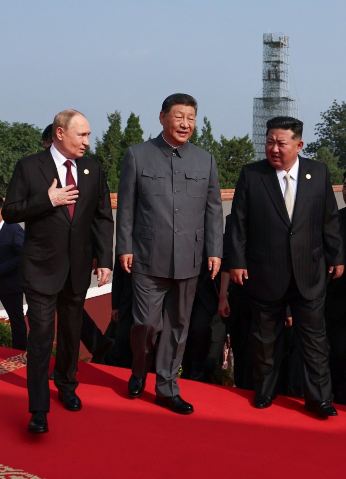 Putin, Xi Jinping, and Kim Jong Un walking on a red carpet.