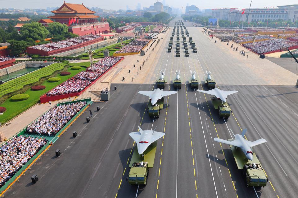 Military parade in Beijing with drones and other weaponry.