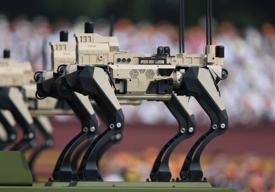 Unmanned warfare robots at a military parade.