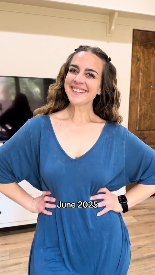 Woman in teal dress after weight loss.