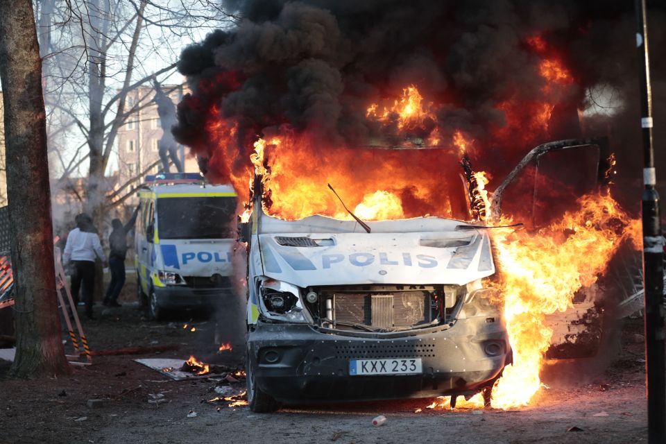 Burning police van at a counter-protest.